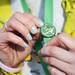 A participant places a pin on her medal after Shamrocks and Shenanigans on Sunday, March 10. Daniel Brenner I AnnArbor.com